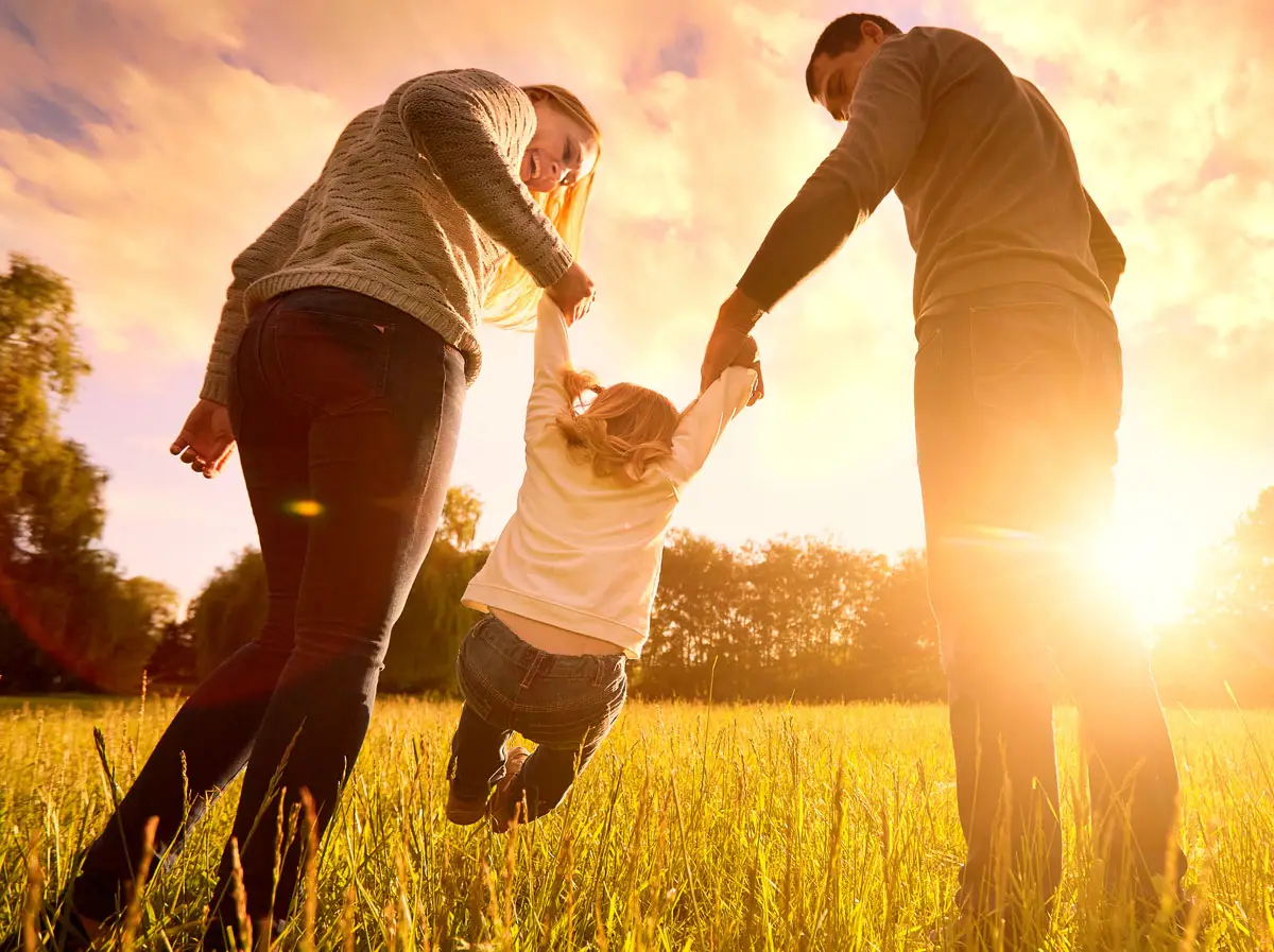 Happy Family Playing In Backyard